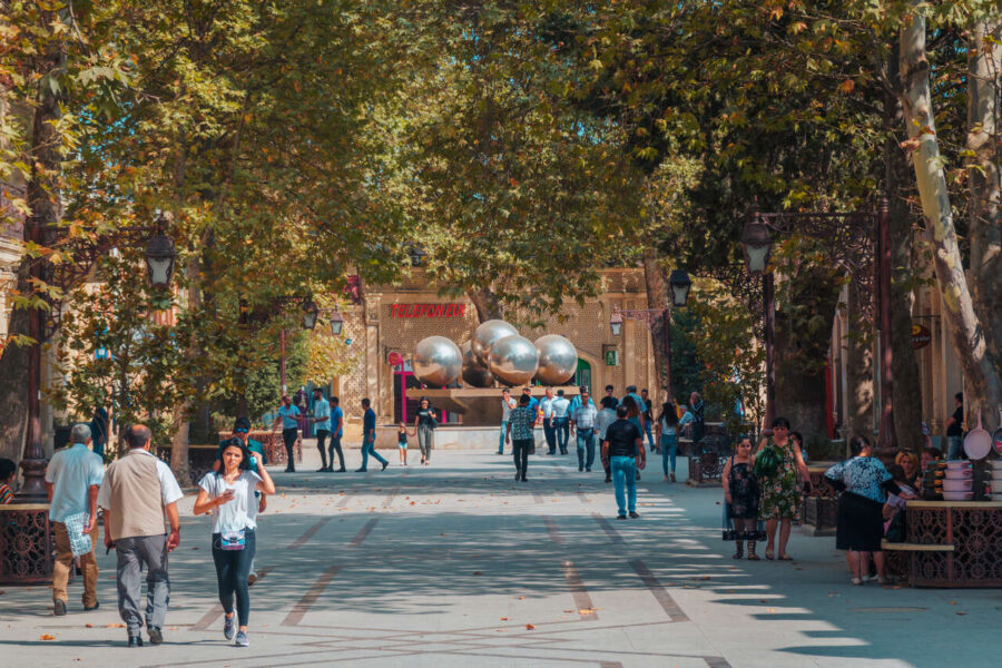 Javad Khan Street in Ganja, 7 days Azerbaijan, a bustling urban thoroughfare surrounded by historical architecture, vibrant shops, and a lively atmosphere.